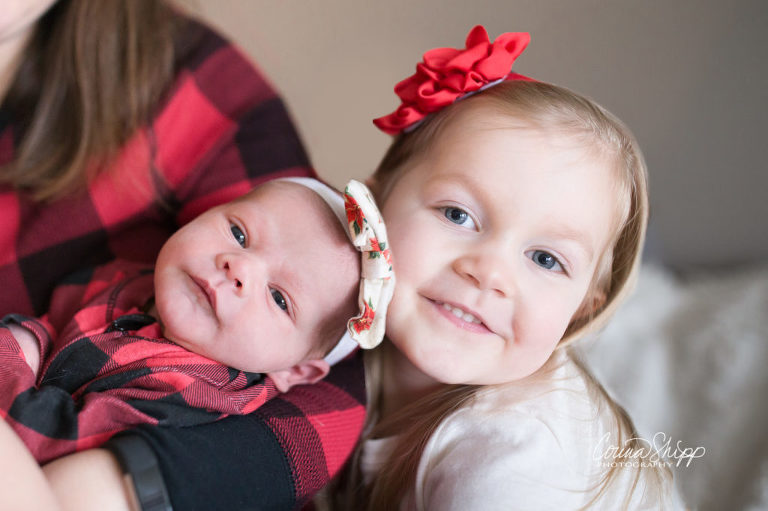 Newborn Lifestyle Photographer in Vancouver WA - sisters smiling
