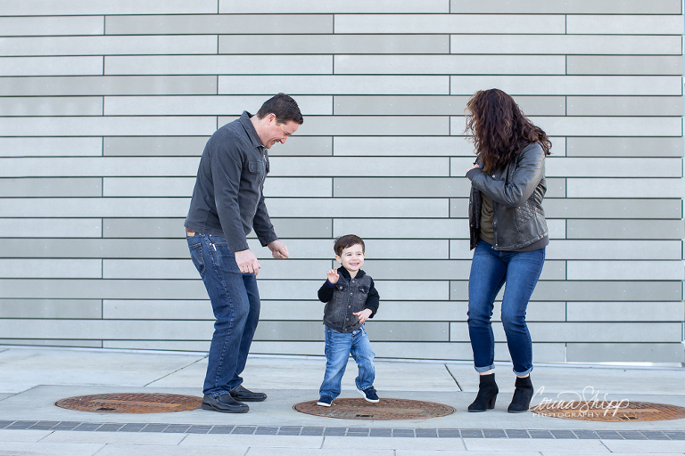 Corina Shipp Photography-Vancouver Wa Family Photographer-Family of three dances on the sidewalk